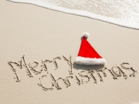 merry_christmas_written_sand_with_santa_hat_1252_463.jpg